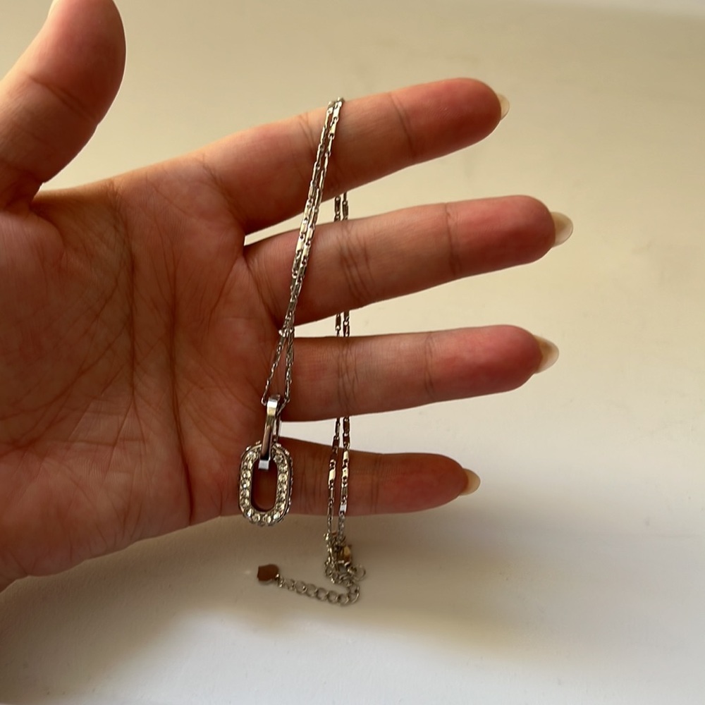 Silver necklace with a thick charm, brand new never worn before, beautiful on.